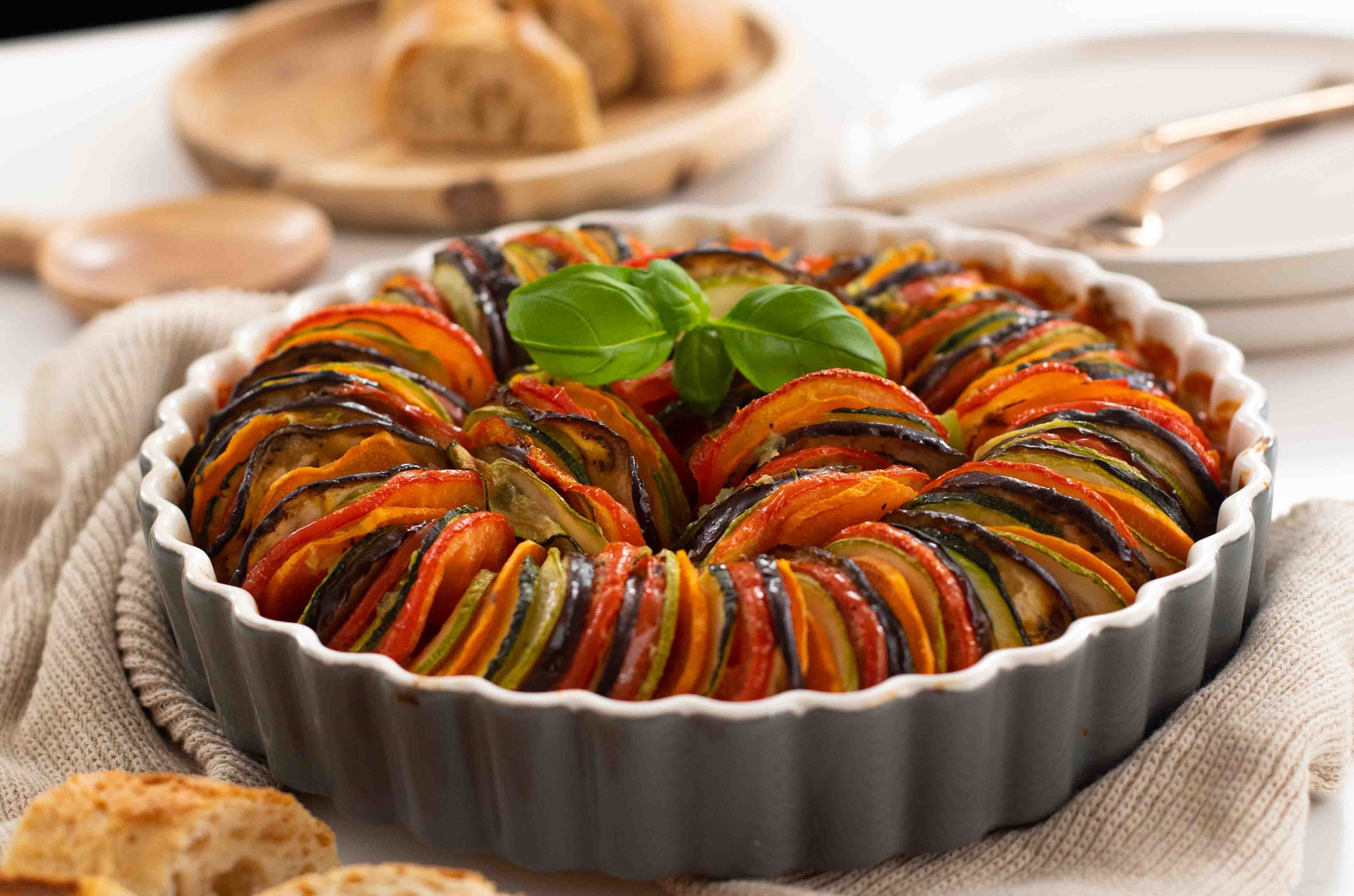 OCD like positioned ratatouille with a basil leaf garnish